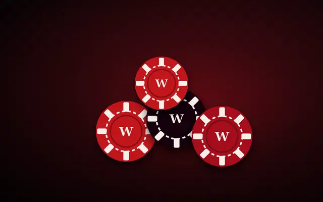 A stack of red and black casino chips