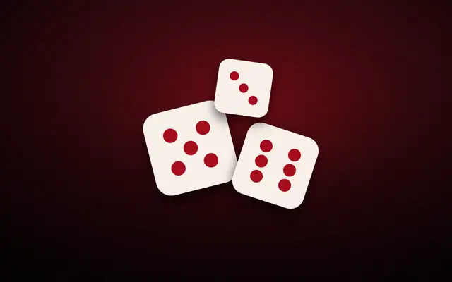 Three dice on a dark red background